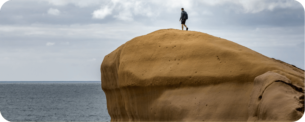 Man walking on a cliff