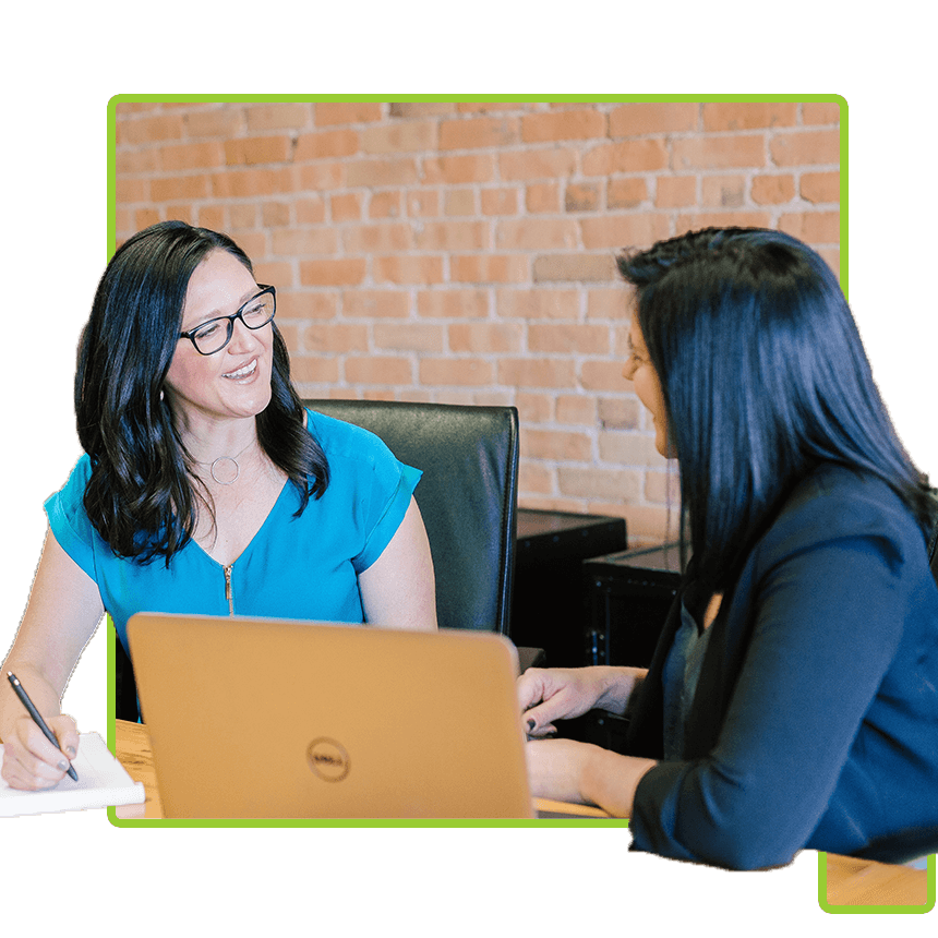 Two women discussing Workflow and Automation