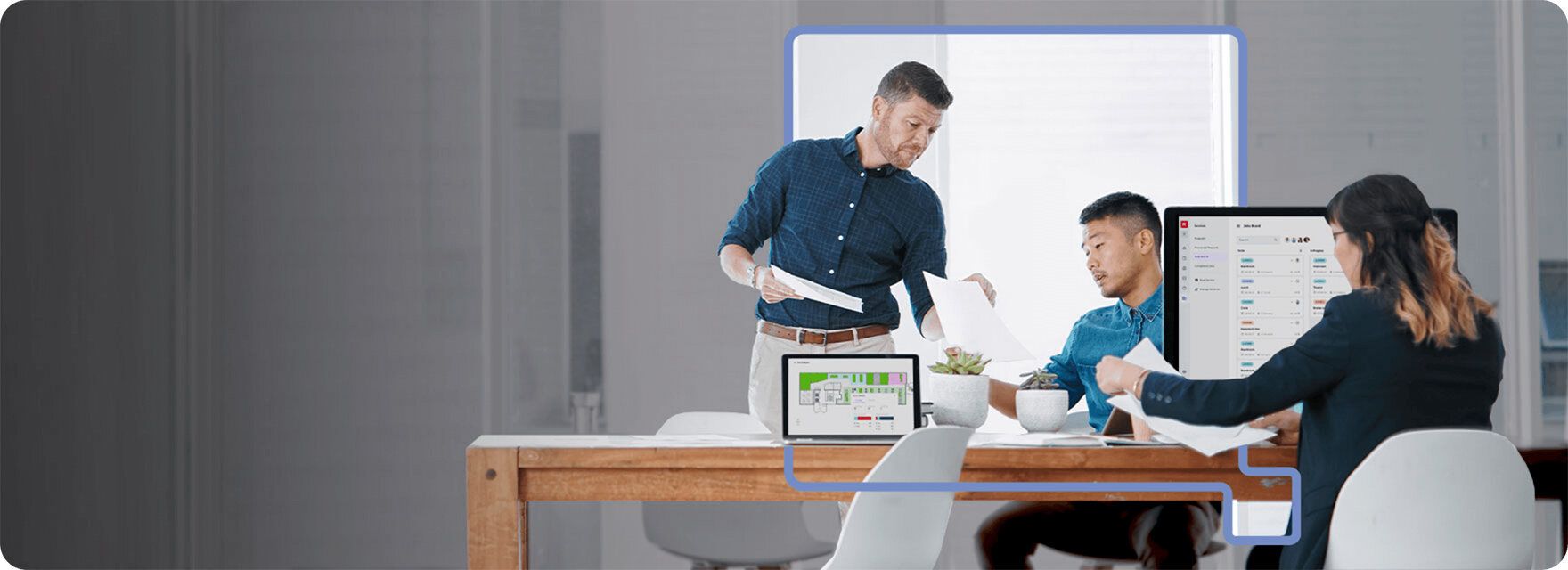 3 people collaborating in a hybrid workplace