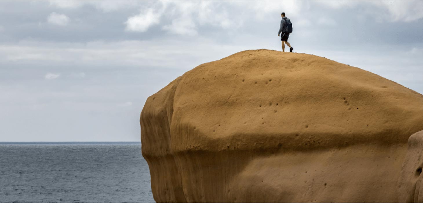 Man walking on a cliff
